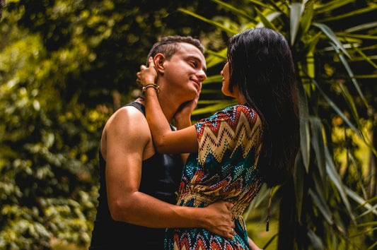 woman holding man's head