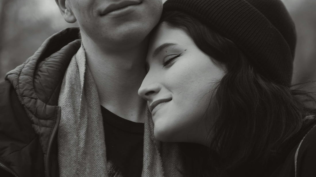 a man and a woman are embracing each other