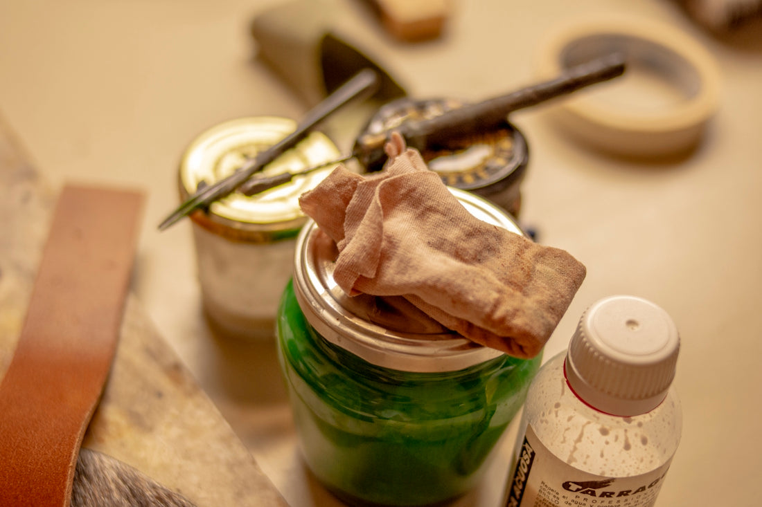 a jar of green stuff sitting on top of a table