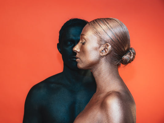 a man and a woman are facing each other