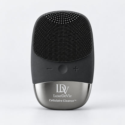 Front view of the black LuxeDeVie Cellulaire Cleanse Signature facial cleansing device with silicone bristles and silver-tone base.
