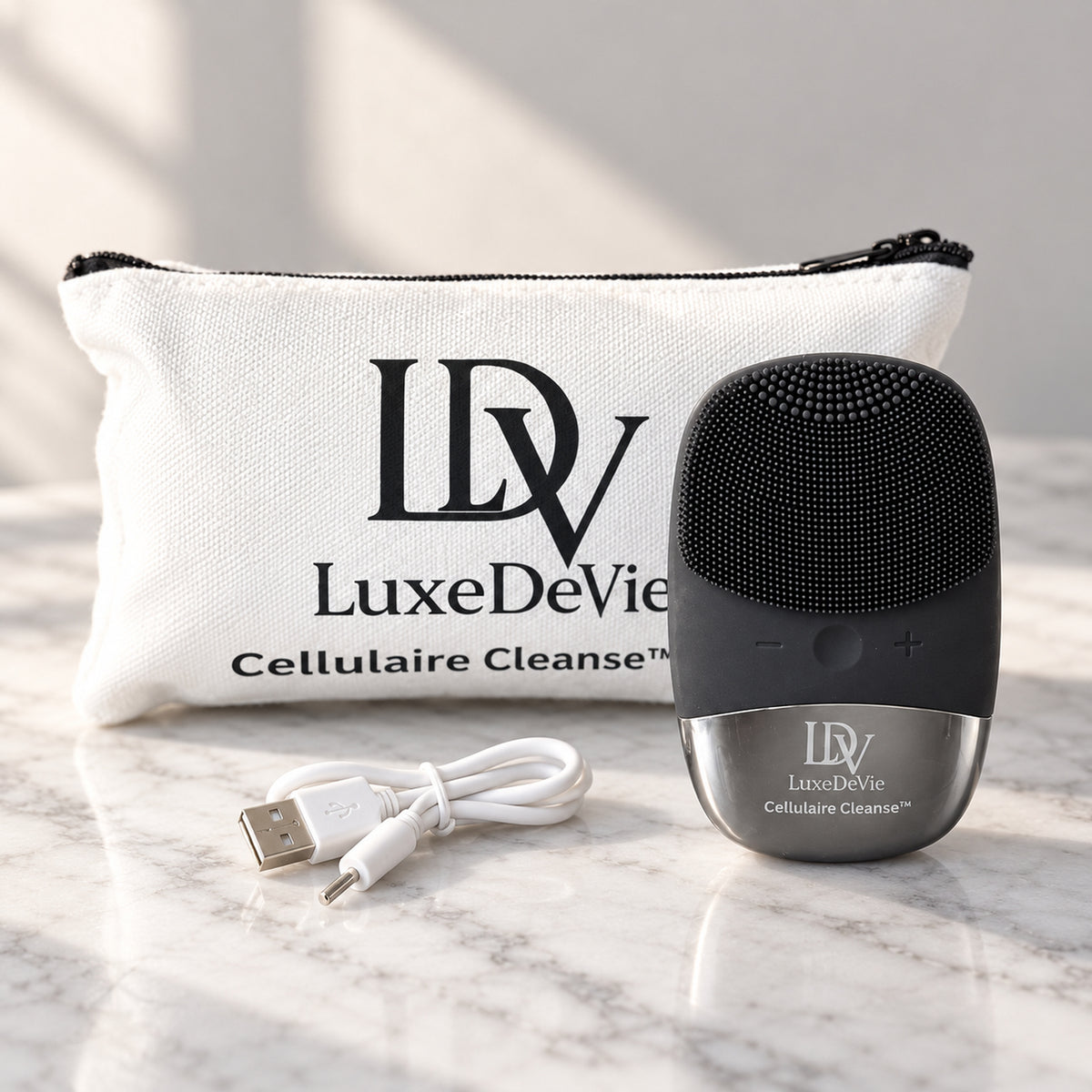 Black Cellulaire Cleanse Signature device beside its white Cellulaire Cleanse Travel Tote and USB charging cable.
