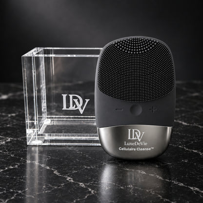 Black Cellulaire Cleanse Signature device with its clear engraved LDV Signature Cradle on dark marble.